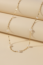 Pearl Link Necklace fine chain necklace with pearl detail additional product view on soft beige background, ZARIÉ fine jewellery SÉRÉNITÉ collection