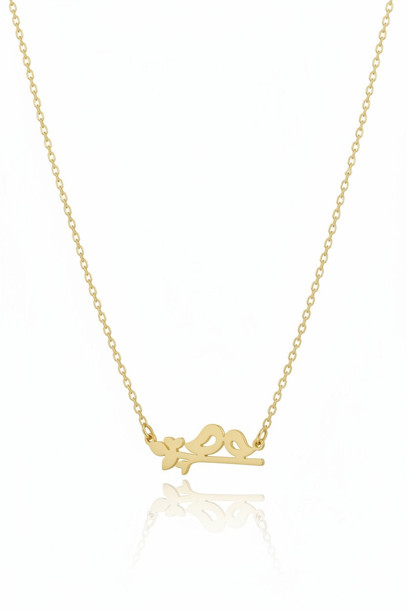 Perched Birds Necklace — Gold fine chain necklace champagne gold-tone lifestyle shot worn on model against neutral background, ZARIÉ fine jewellery SÉRÉNITÉ collection