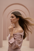 Petal Arc Bracelet delicate bracelet lifestyle shot worn on model against neutral background, ZARIÉ fine jewellery RAYONNE collection