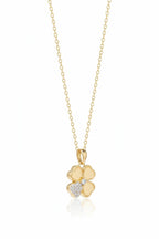 Petite Clover Necklace — Gold fine chain necklace champagne gold-tone four-leaf clover motif additional product view on soft beige background, ZARIÉ fine jewellery HARMONIE collection