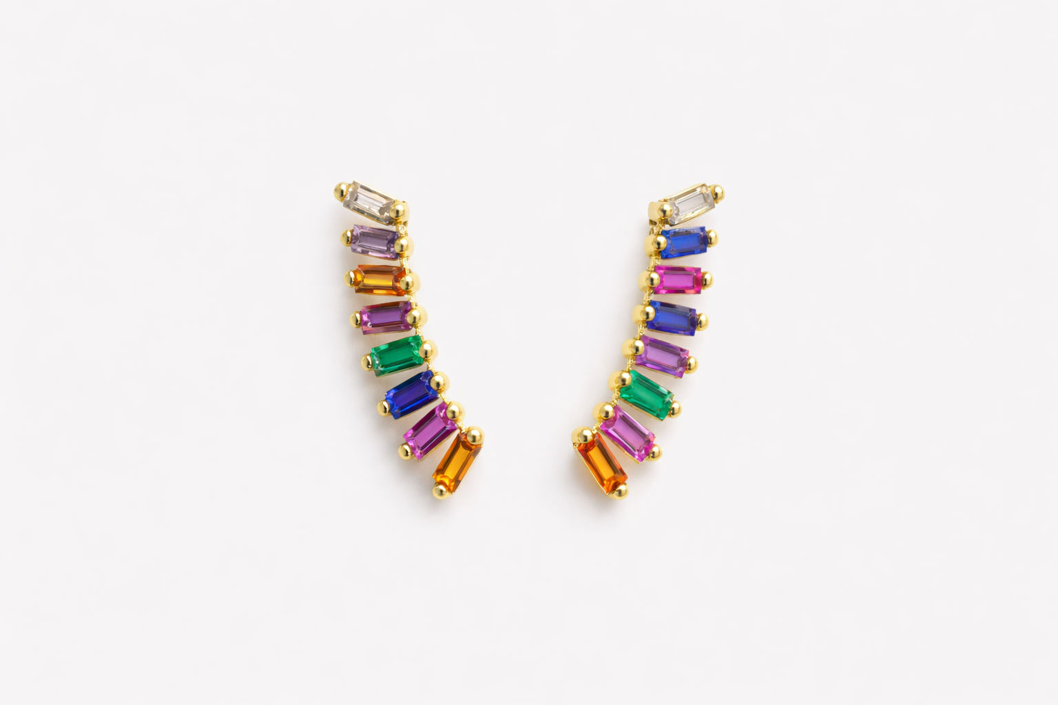 Multicolored gemstone earrings on a white background