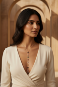 Prisma Drop Necklace — Gold drop earrings champagne gold-tone lifestyle shot worn on model against neutral background, ZARIÉ fine jewellery RAYONNE collection