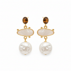 Gold earrings with pearls and brown gemstones on a white background