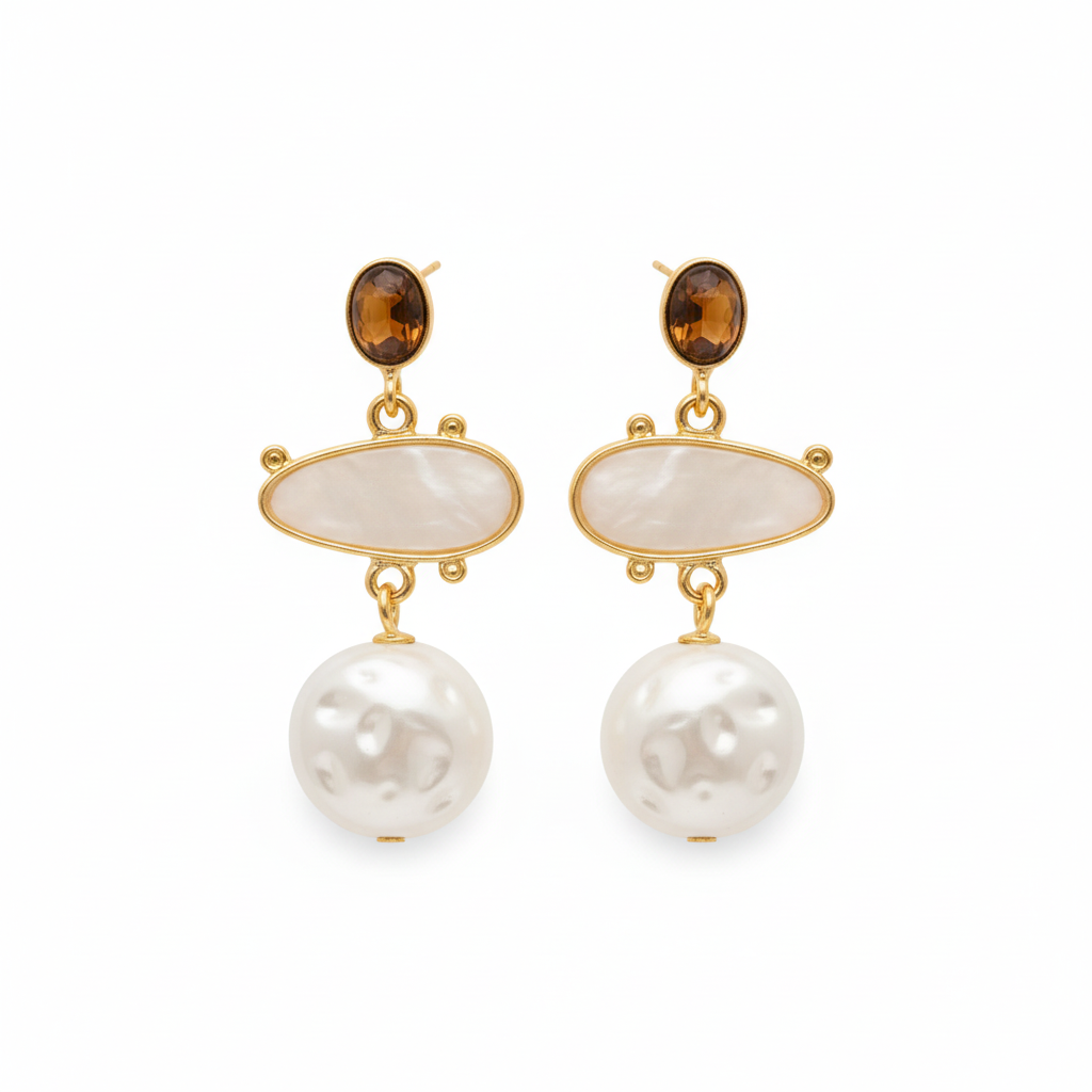 Gold earrings with pearls and brown gemstones on a white background