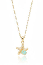 Sea Charm Necklace — Gold fine chain necklace champagne gold-tone on clean white background, product flat lay, ZARIÉ fine jewellery RAYONNE collection