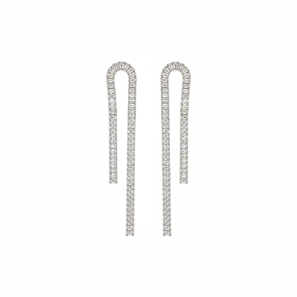 Pair of silver earrings with clear gemstones on a white background
