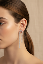 Earring worn by a model with a neutral background