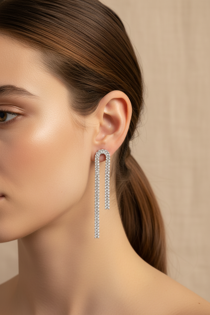 Earring worn by a model with a neutral background