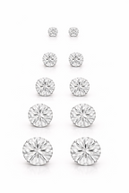 Set of diamond stud earrings on a white background
