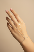 Sleek Aura Line Handpiece fine jewellery piece on clean white background, product flat lay, ZARIÉ fine jewellery ÉLORA collection