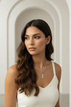 Solitaire Wing Necklace — Silver fine chain necklace silver-tone lifestyle shot worn on model against neutral background, ZARIÉ fine jewellery ÉLORA collection