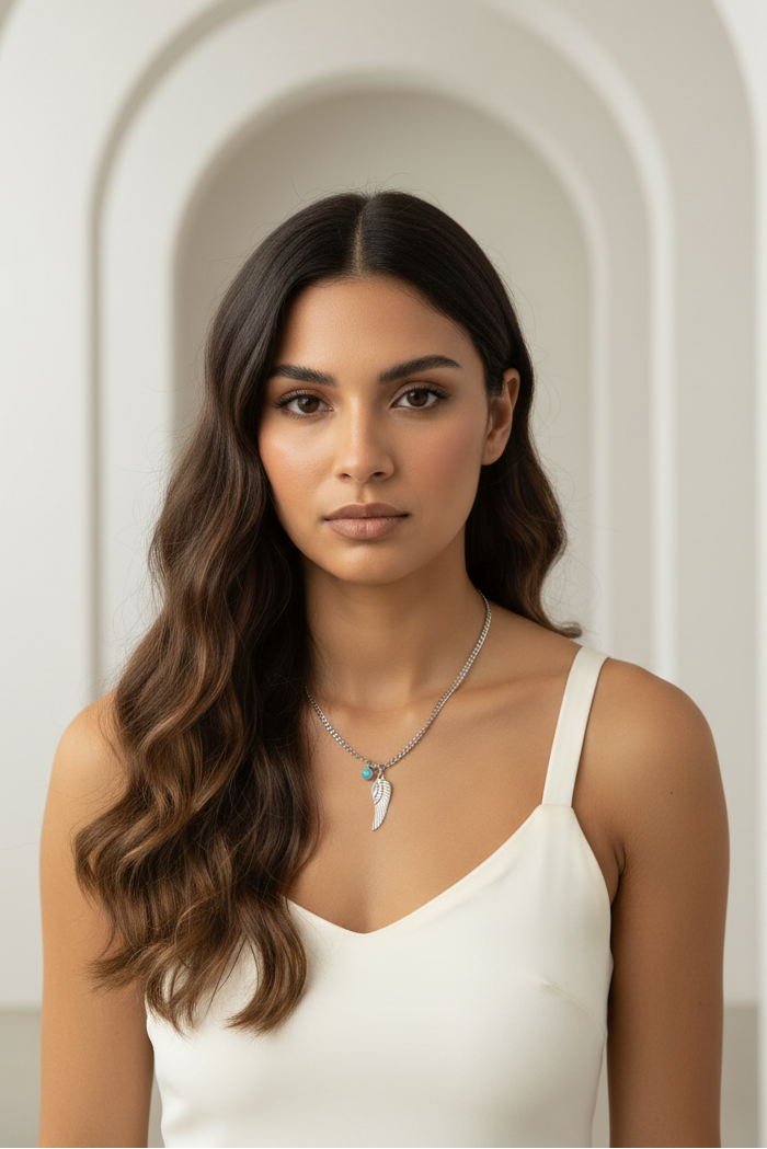 Solitaire Wing Necklace — Silver fine chain necklace silver-tone lifestyle shot worn on model against neutral background, ZARIÉ fine jewellery ÉLORA collection