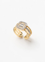 Close-up of champagne gold square halo open ring showing geometric square frame with pavé crystal border, adjustable open band design, polished finish against natural skin tones with delicate refined craftsmanship