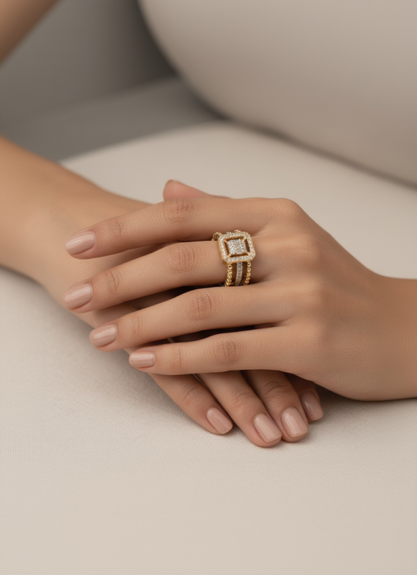 Square halo open ring in champagne gold with pavé crystal detailing photographed on soft beige linen background, showing adjustable open band and geometric square motif, minimal elegant design with warm beige aesthetic