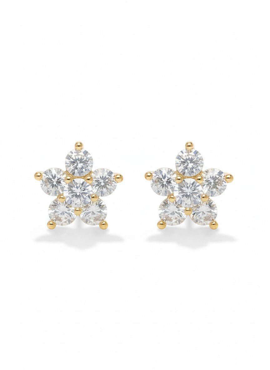 Pair of diamond stud earrings with gold accents on a white background