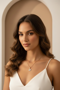 Swan Crest Necklace — Gold fine chain necklace champagne gold-tone lifestyle shot worn on model against neutral background, ZARIÉ fine jewellery LUMIÈRE collection