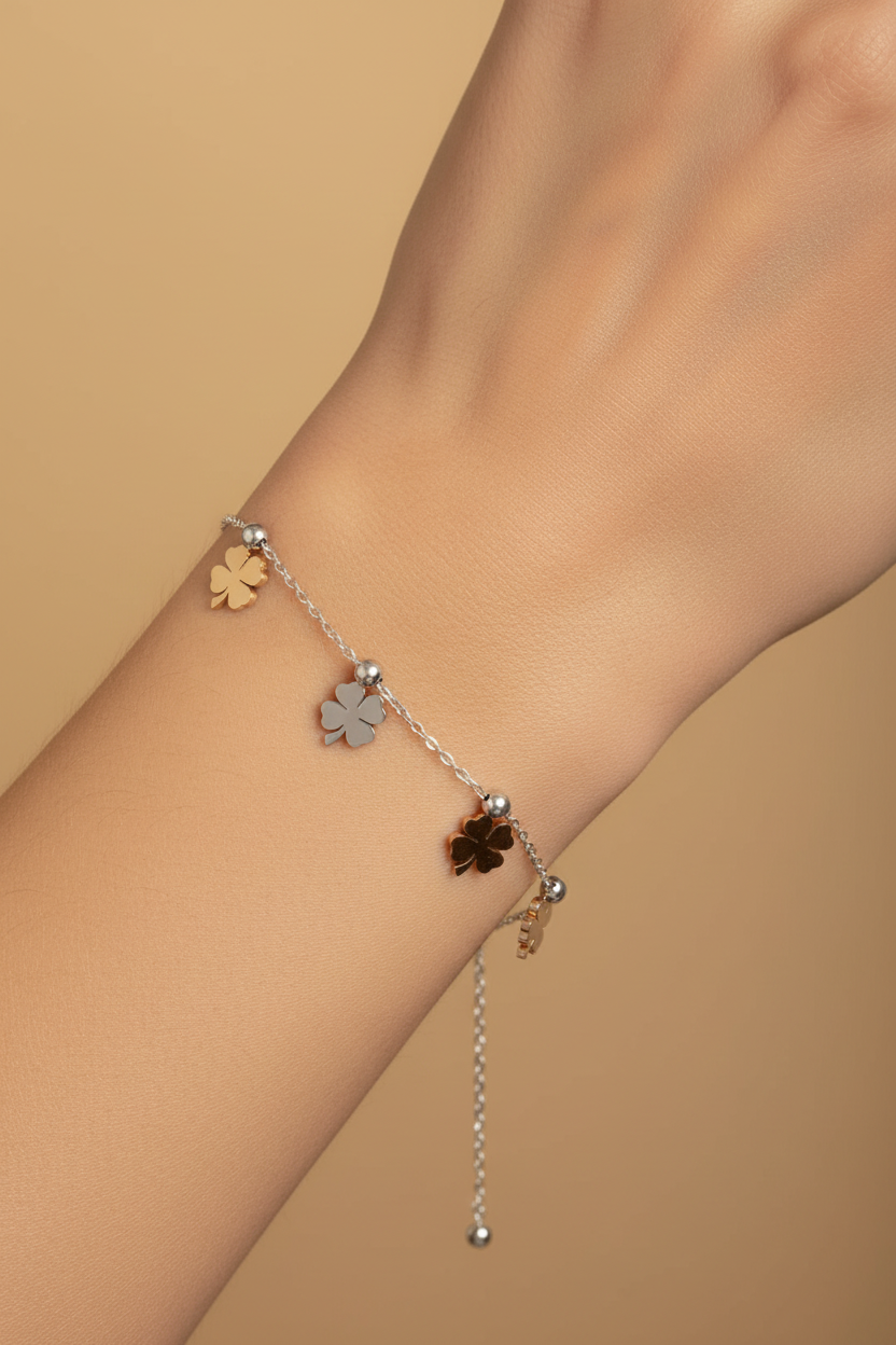 Tri-Tone Clover Chain Bracelet fine chain necklace four-leaf clover motif lifestyle shot worn on model against neutral background, ZARIÉ fine jewellery HARMONIE collection