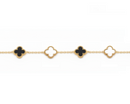 Gold bracelet with black clover-shaped charms on a white background