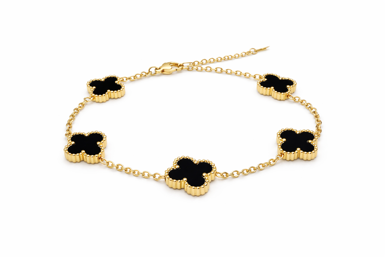 Verre Clover Bracelet — Black on Gold delicate bracelet champagne gold-tone four-leaf clover motif on clean white background, product flat lay, ZARIÉ fine jewellery SÉRÉNITÉ collection