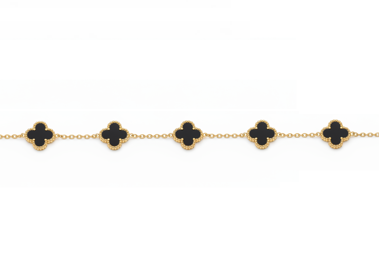 Verre Clover Bracelet — Black on Gold delicate bracelet champagne gold-tone four-leaf clover motif on clean white background, product flat lay, ZARIÉ fine jewellery SÉRÉNITÉ collection