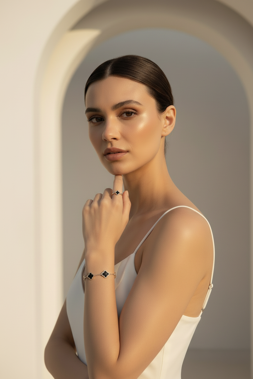 Woman wearing a bracelet with a minimalistic design against a neutral background