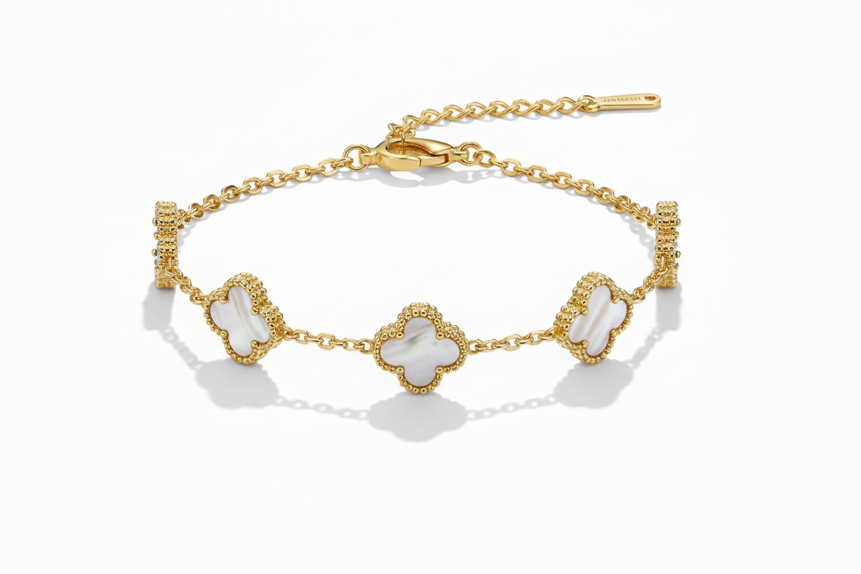 Gold bracelet with clover-shaped charms on a white background