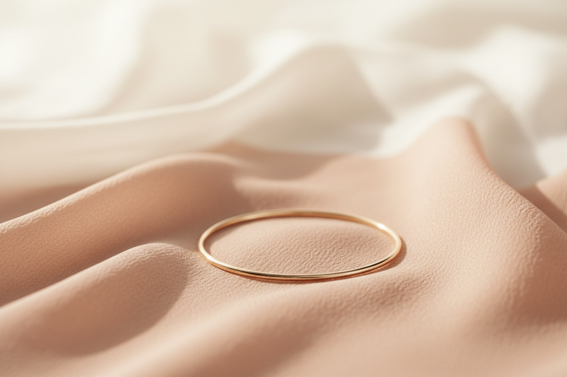 Gold ring on a soft fabric surface