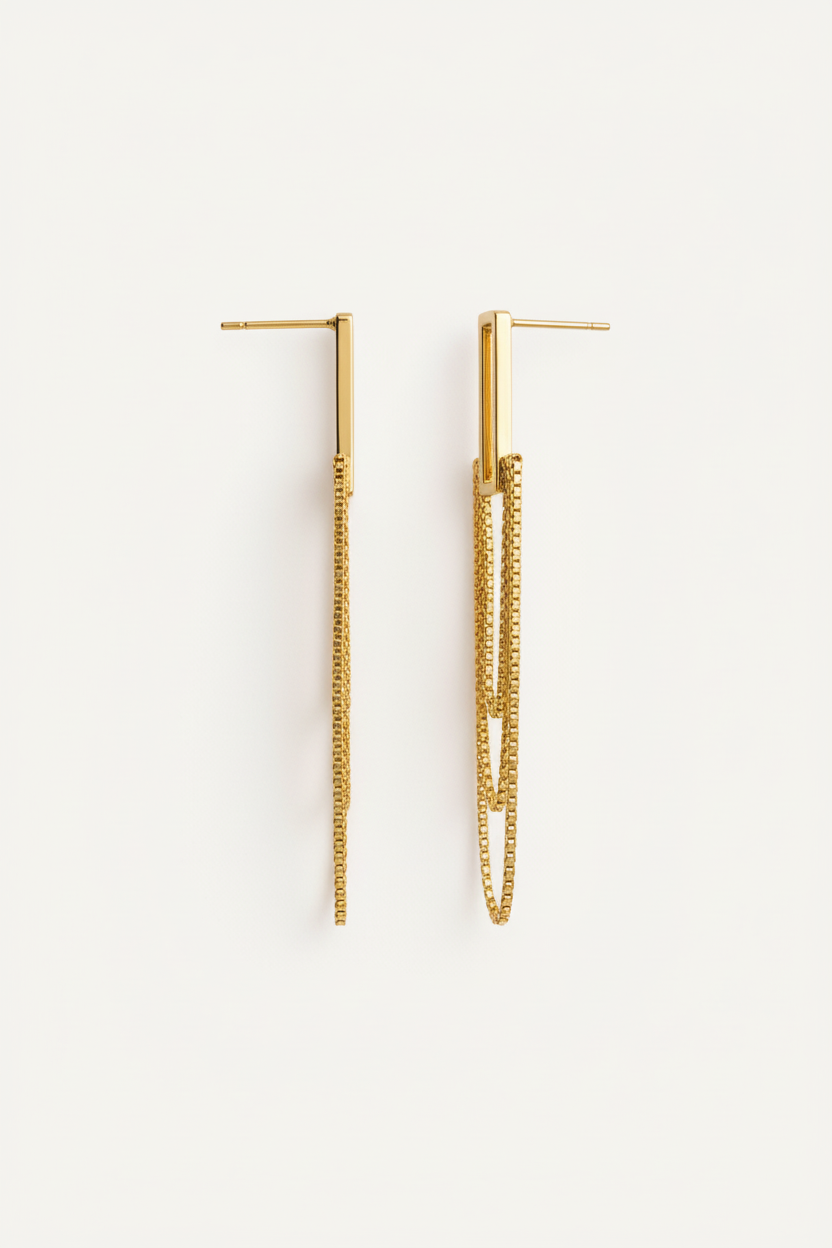 Gold hoop earrings on a white background