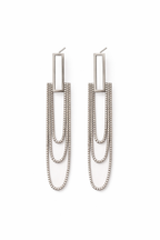 Pair of silver chain earrings on a white background